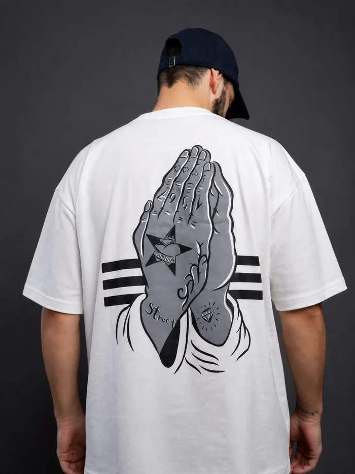 Praying hands back print on a cream white t-shirt
